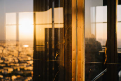 Close-up of building seen through glass window