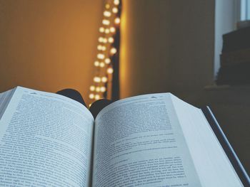 Close-up of open book at home