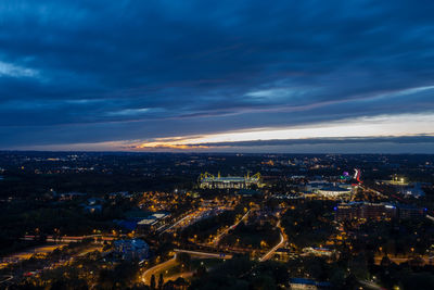 High angle view of city lit up at night