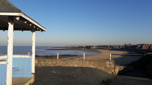 Scenic view of beach against clear sky