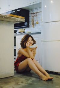 Young woman sitting at camera