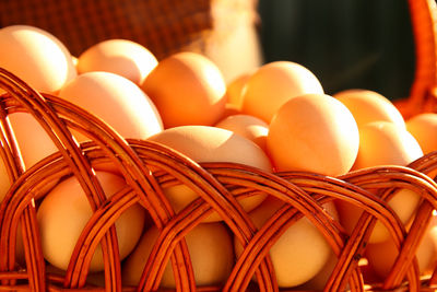 Many eggs in basket. closeup whole basket of brown organic eggs on modern background. poultry farm.