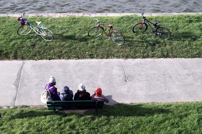 People in bicycle on field