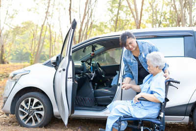 Rear view of people sitting in car