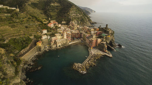 High angle view of buildings by sea