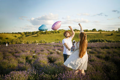 Happy couple having fun on lavender field