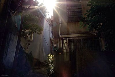 Sun shining through building