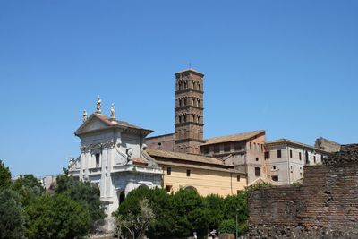 Low angle view of historical building against clear blue sky