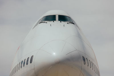 Low angle view of airplane against clear sky