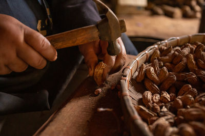 Midsection of man working on table