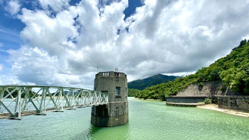 Bridge over sea against sky