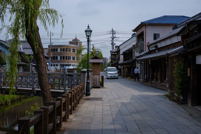 Street amidst buildings against sky