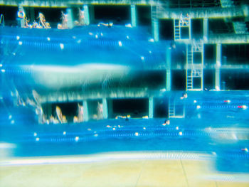 Abstract image of illuminated swimming pool in city