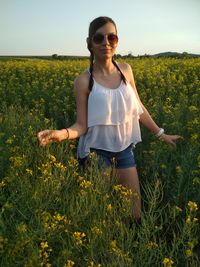 Young woman standing on field