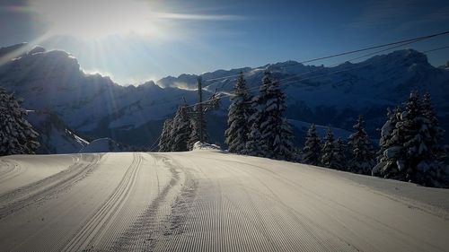 Scenic view of snow covered mountains against sky