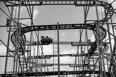 Low angle view of ferris wheel against sky