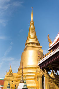 Low angle view of pagoda against building