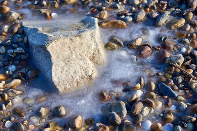 Full frame shot of pebbles on beach