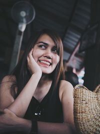 Smiling young woman looking away