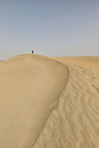 Scenic view of desert against clear sky