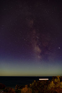 Scenic view of star field against sky at night