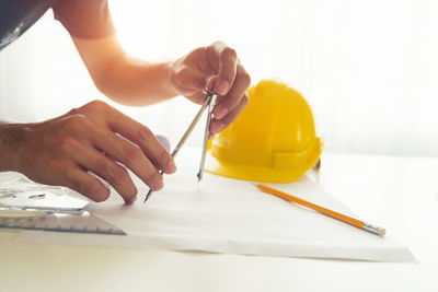 Midsection of person working on table