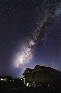 Low angle view of building against sky at night