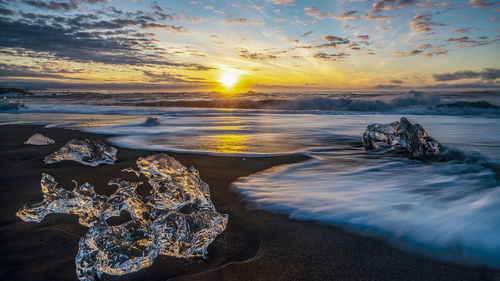 Scenic view of sea against sky during sunset