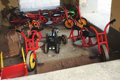 Bicycle parked on red floor