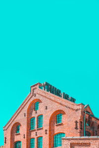 Low angle view of building against blue sky