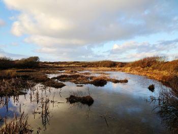 Scenic view of lake against sky