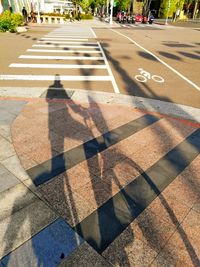 High angle view of man shadow on street