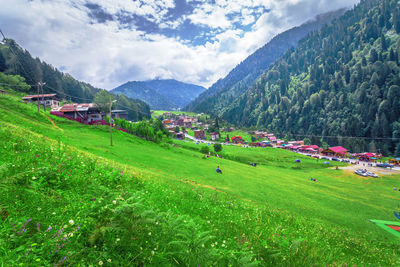 Scenic view of landscape and mountains against sky