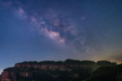 Scenic view of star field against sky at night