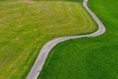 High angle view of road amidst field