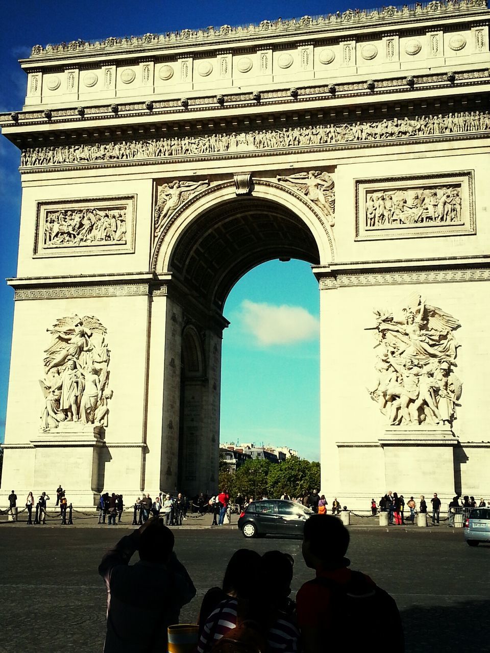 architecture, built structure, building exterior, arch, sky, famous place, street, men, city, history, road, travel destinations, incidental people, travel, person, car, tree, tourism, tourist