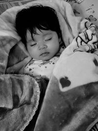 Cute baby sleeping on bed at home