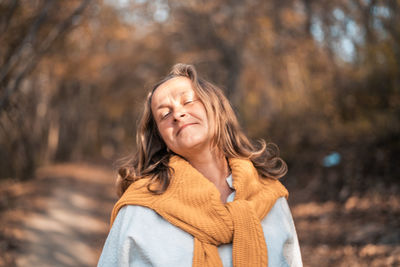 Portrait of a smiling young woman in winter