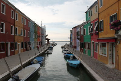 Boats moored in sea