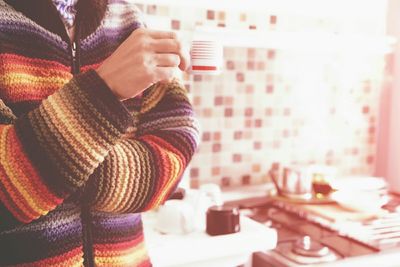 Person holding coffee cup