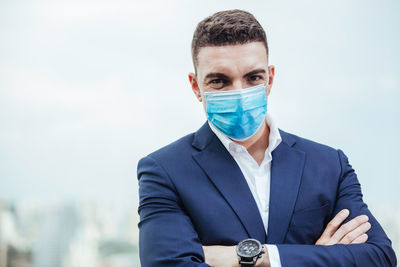 Portrait of young man wearing mask