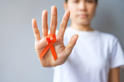 Close-up of hand against white background