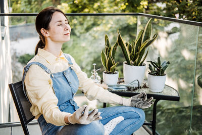Young woman sitting on chair