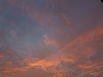 Low angle view of dramatic sky during sunset