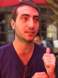 Portrait of young man standing outdoors