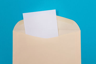 Close-up of paper against blue background