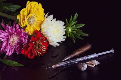 High angle view of flower bouquet on table against black background