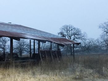 Built structure on field against clear sky