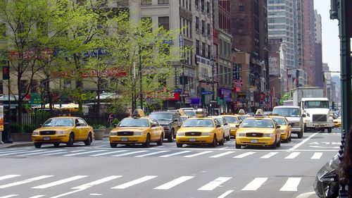 Yellow taxis and cars on street