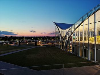 Modern building against clear sky at dusk